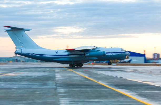 istock Russian cargo airplane IL 76 taking off close - up blur in motion. 1009637672