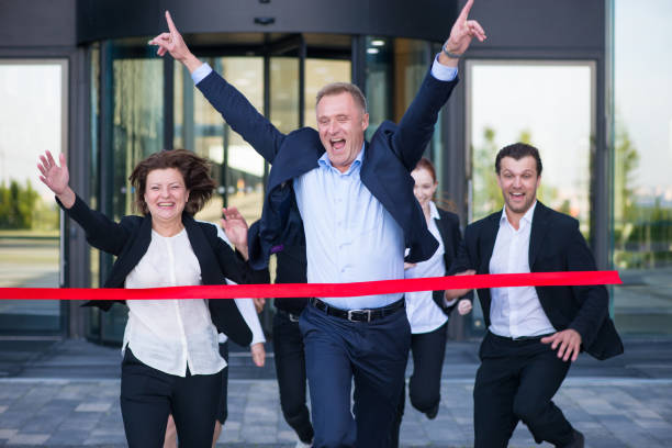 istock Business people crossing the finish line 1009638244