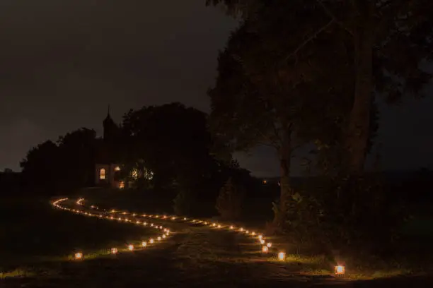 Candles are placed along the way to a chapel