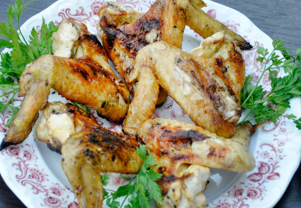 istock apetitic fried chicken cranberries in a plate on a dark wooden table. 1009641350