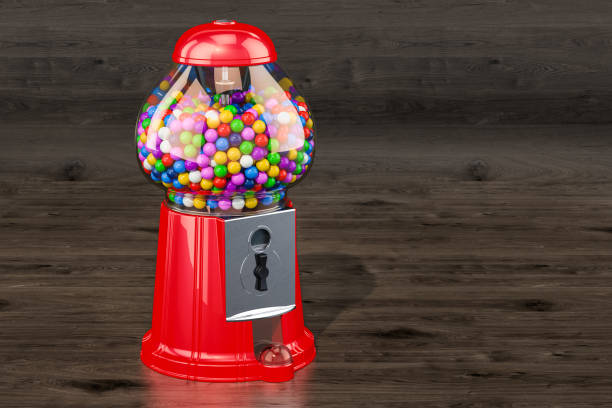 istock Gumball machine, gum dispenser on the wooden background. 3D rendering 1009641540