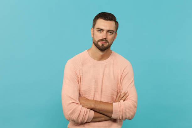 istock studio portrait of an attractive 30 year old man with a beard on a blue background 1009644092