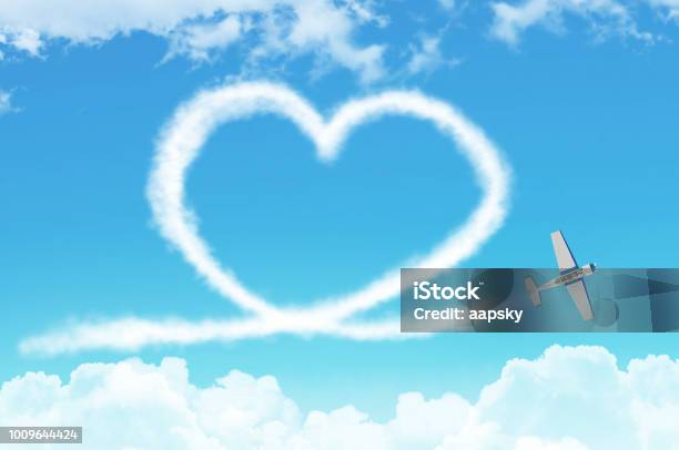 Love Figurative Heart From A White Smoke Trail Lightengine Airplane Among The Clouds Stock Photo - Download Image Now