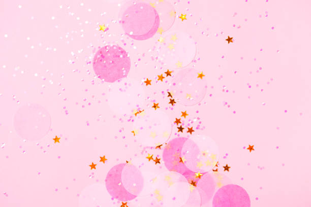 istock Pink confetti and stars and sparkles on pink background. 1009644680