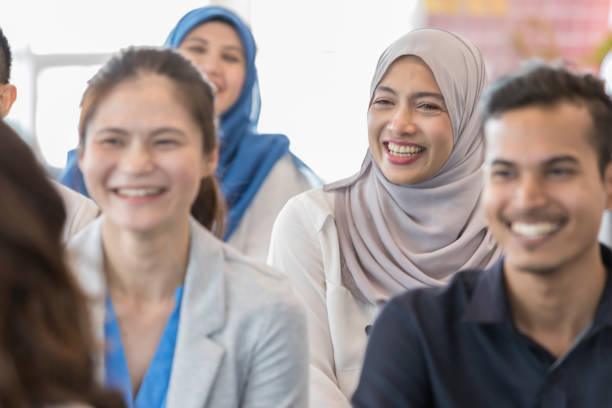 istock Malaysian business people laugh during conference 1009647188