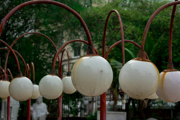 istock Old lamp, white ball stuck to the red pillars. 1009648034