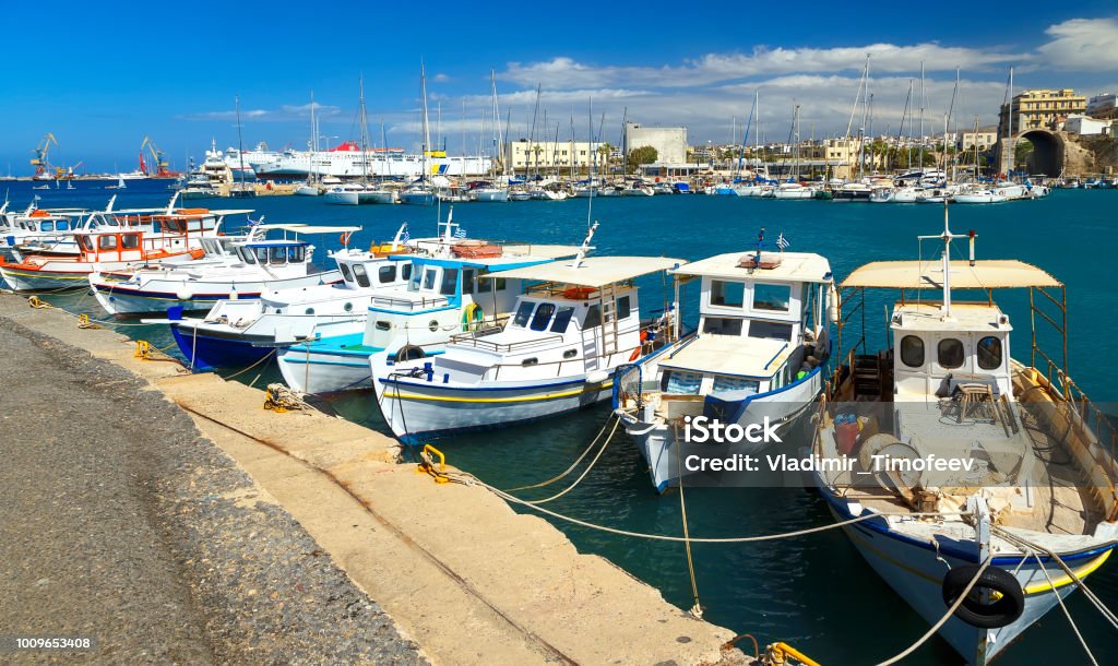 Travel photography: Fishing boats. Port of Heraklion, Crete, Greece Castle Stock Photo