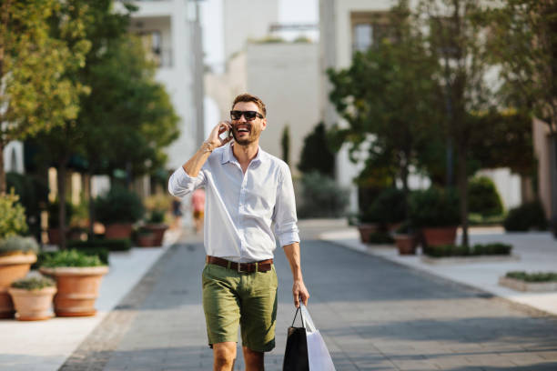 istock Man shopping in town 1009654358