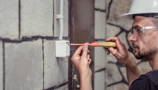 istock male electrician-technician, connects the equipment with a tool 1009658830