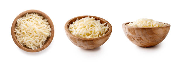 heap of grated mozzarella bowls with grated mozzarella cheese isolated on white background shredded mozzarella stock pictures, royalty-free photos & images