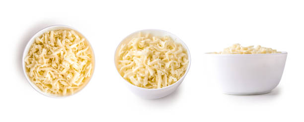 heap of grated mozzarella bowl of grated mozzarella cheese isolated on white background shredded mozzarella stock pictures, royalty-free photos & images