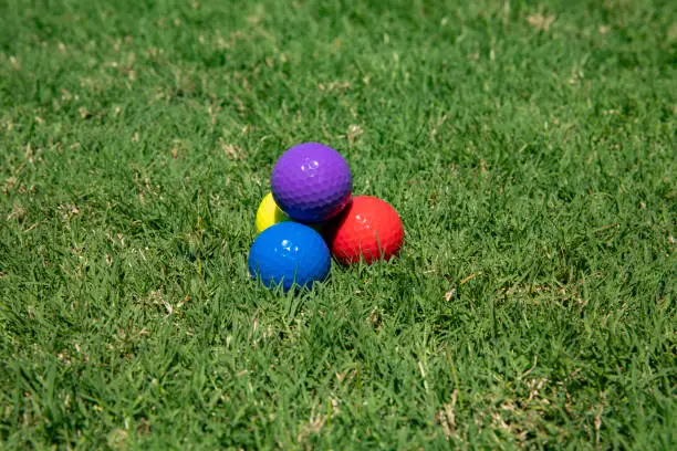 Golf balls in grass