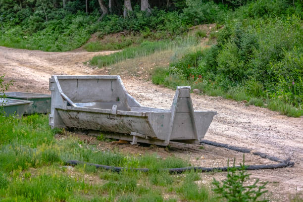 istock Dumpster on the edge of trail 1009671860
