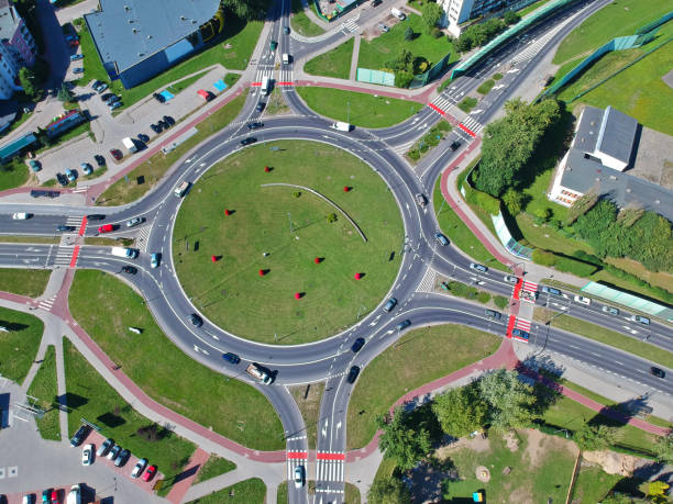 istock Roundabout intersection in five directions with island, aerial view 1009671930