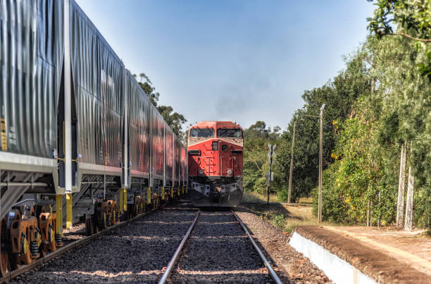istock Freight trains passing by old railway station in a city 1009679458