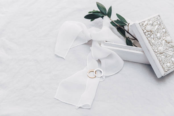 istock Wedding rings on gold tray with olive branch. Stylish wedding concept 1009680536