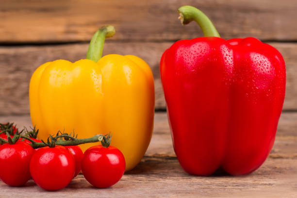 istock Collection of vegetables on wooden background. 1009683046