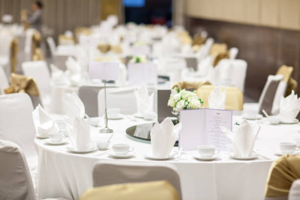 istock wedding table sets in wedding hall. wedding decorate preparation. 1009688510