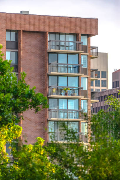 istock Residential high rise with trees 1009688692