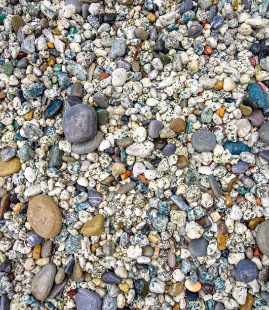 istock Abstract background texture, Colorful sea stones, top view 1009691622