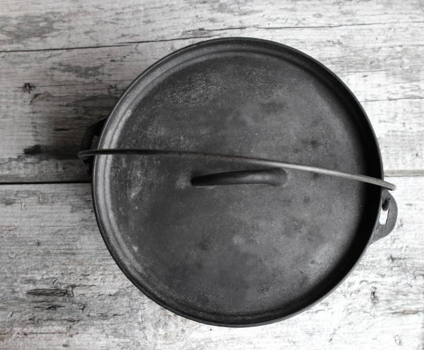 istock Cast Iron Dutch Oven Looking Down On Wood Background 1009692182
