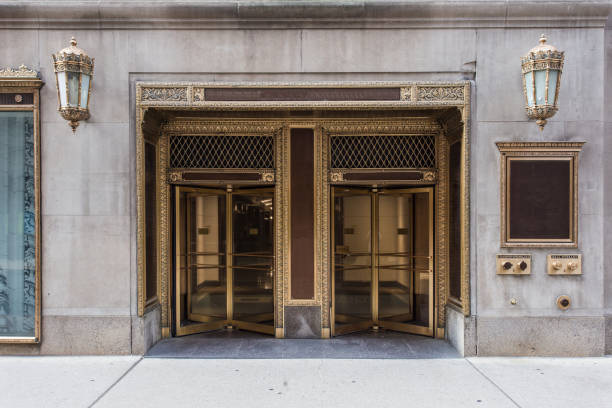 istock Two golden revolving doors 1009699814