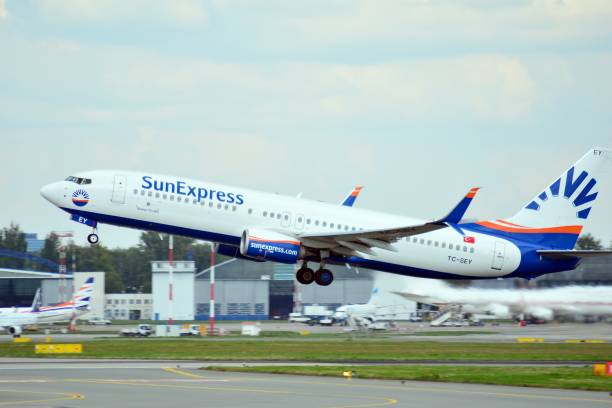 Airplane  TC-SEY SunExpress Boeing 737-8HC(WL) taking off from the Warsaw Chopin Airport. Warsaw, Poland. 26 July 2018. Airplane  TC-SEY SunExpress Boeing 737-8HC(WL) taking off from the Warsaw Chopin Airport. sunexpress stock pictures, royalty-free photos & images