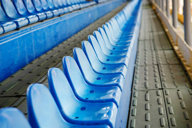 istock Empty plastic chairs in the stands of the stadium 1009738668