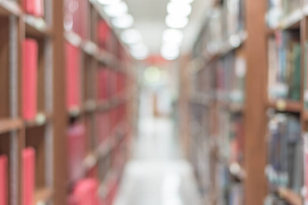 istock Blur school library or study room with book shelves for education background 1009742272