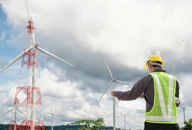 istock Engineer worker at wind turbine power station construction site 1009742690