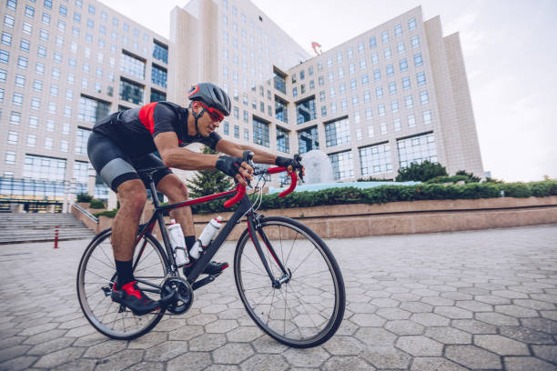 istock Man in city on racing bicycle 1009749414