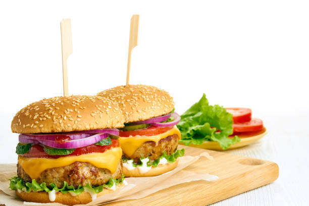 istock Two juicy cheeseburgers close-up 1009749782