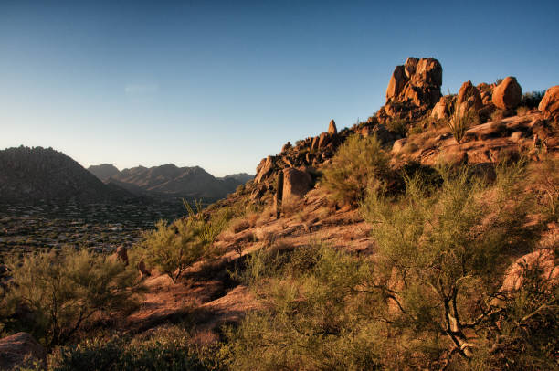 istock Pinnacle Peak Park as sun rises over cactus and hiking trails. 1009759610