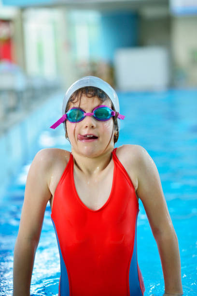 istock Pretty little girl in swimming pool 1009759802