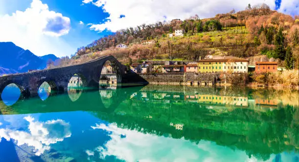 Photo of Ponte Diavolo - pictorial medieval Devil's bridge near Lucca, Tuscany, Italy