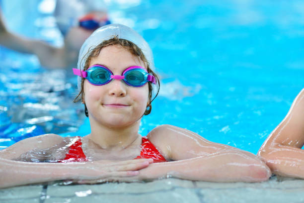 istock Pretty little girl in swimming pool 1009771480