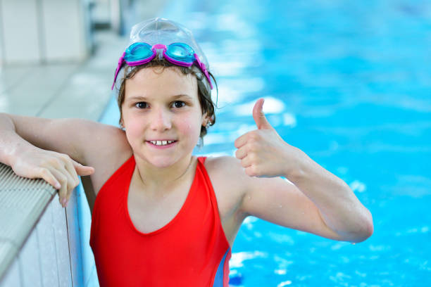 istock Pretty little girl in swimming pool 1009773630