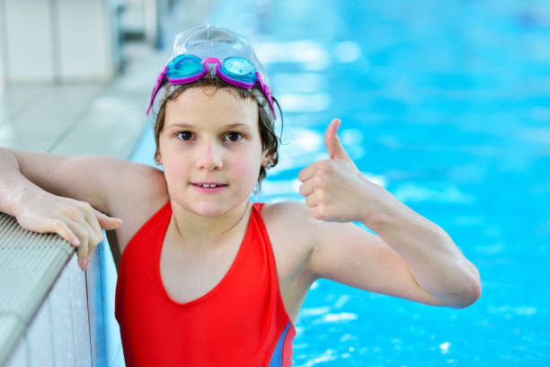 istock Pretty little girl in swimming pool 1009779192
