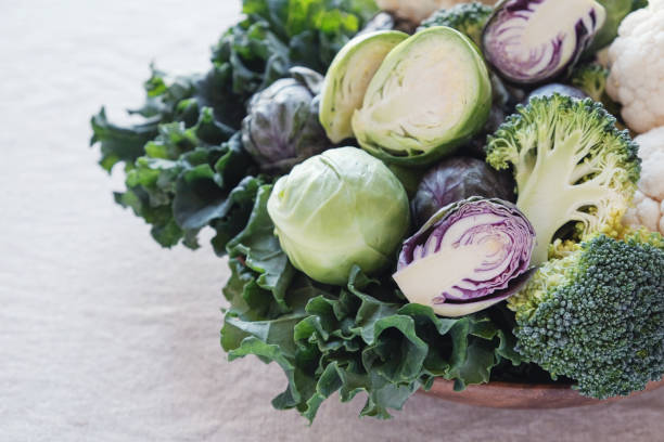 istock cruciferous vegetables, cauliflower,broccoli, Brussels sprouts, kale in wooden bowl, reducing estrogen dominance, ketogenic diet 1009779662
