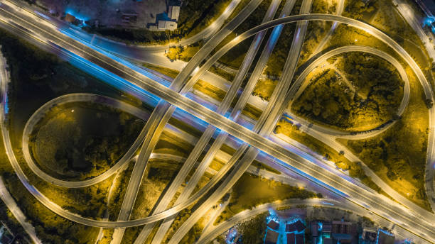istock Aerial view network or intersection of highway road for transportation or distribution concept background. 1009789952