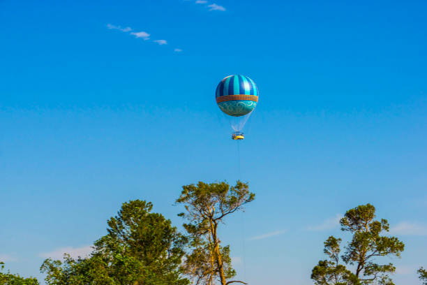 istock Hot air balloons flying on the blue sky 1009822618