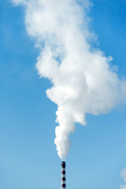 istock The chimney with white smoke into the sky 1009822674