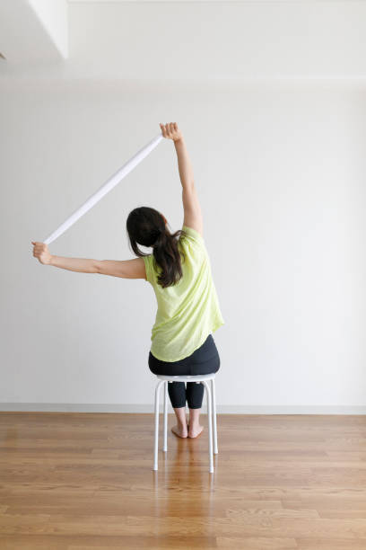 istock Asian women exercising with towel 1009849752