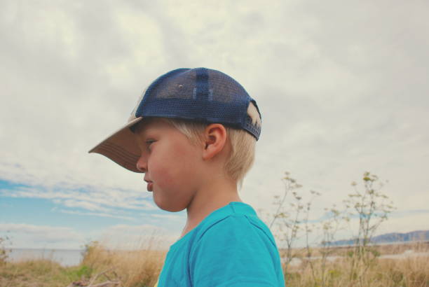 istock Child in a Cap in Rural Scene 1009854598