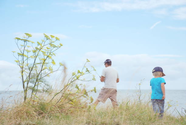 istock A Father and his Child in a Meadow 1009854842
