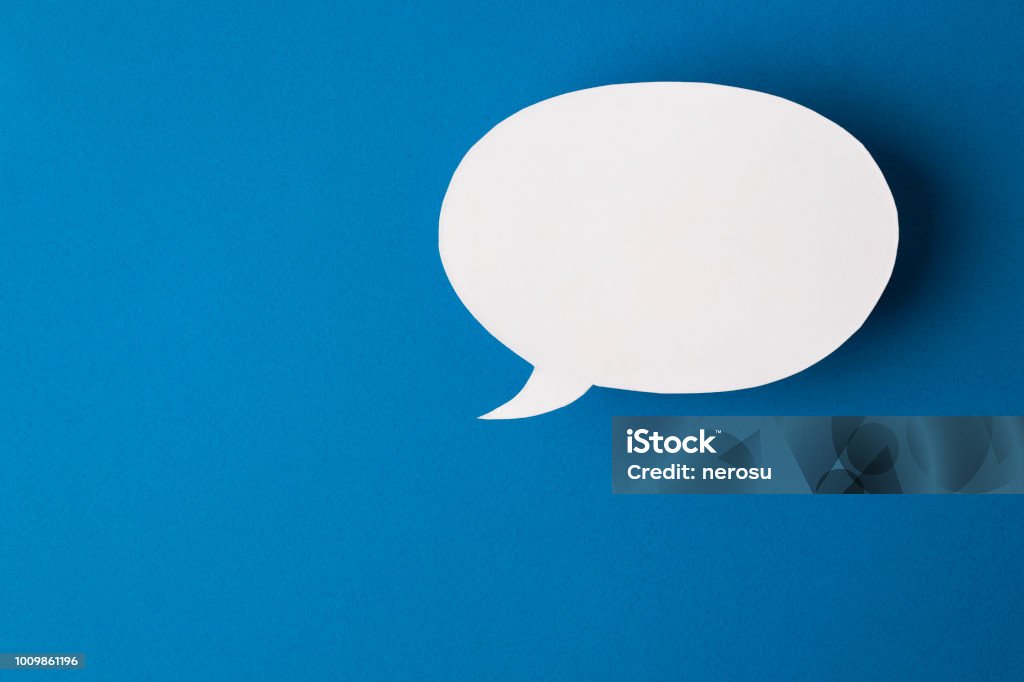 speech bubble on blue background speech bubble on blue background. Discussion Stock Photo