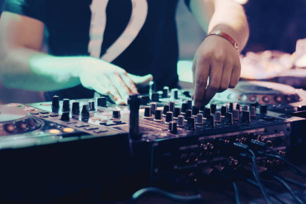 istock dj playing music at party 1009883188