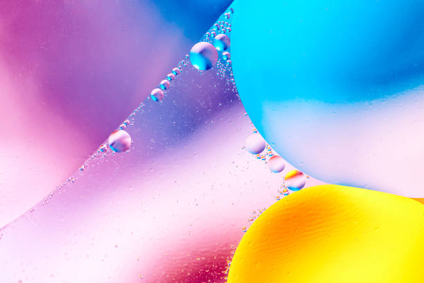 istock Abstract background with colorful gradient colors. Oil drops in water abstract psychedelic pattern image. Pastel colored 1009899164