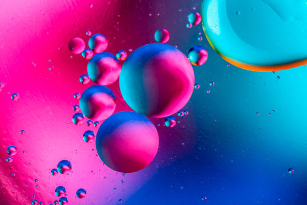istock Abstract background with colorful gradient colors. Oil drops in water abstract psychedelic pattern image. 1009899170