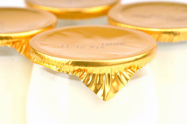 Close-up of plain yogurts in pots